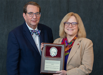 Bruce H. Cohen, Child Neurology Society President, left, and Amy Brooks-Kayal, as she received the Bernard Sachs Award earlier this month.