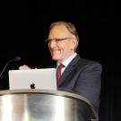 Dr. Ron Mangun standing at a lectern